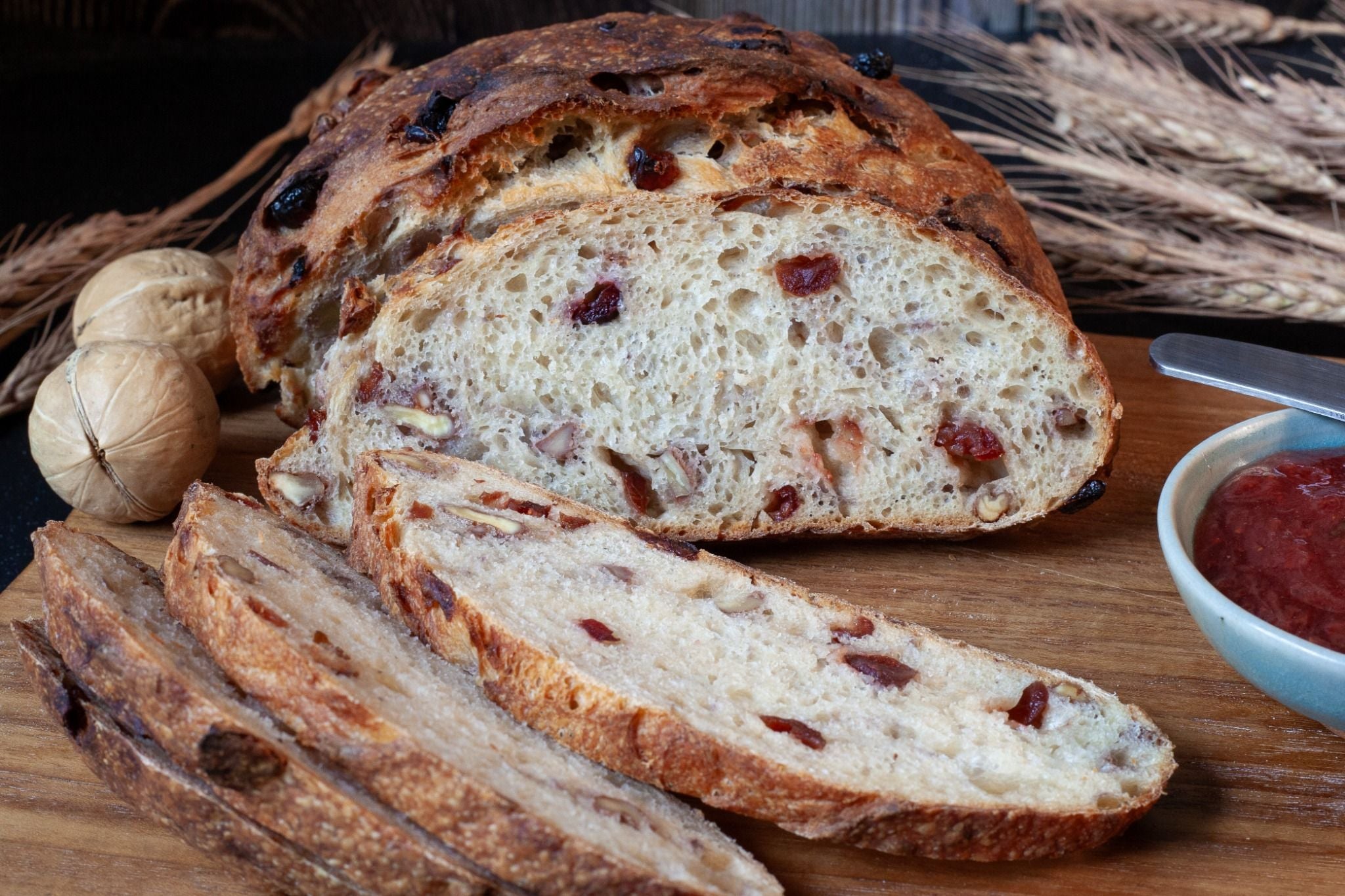 Freshly baked Cranberry Walnut Sourdough loaf with a crisp crust and hearty interior.