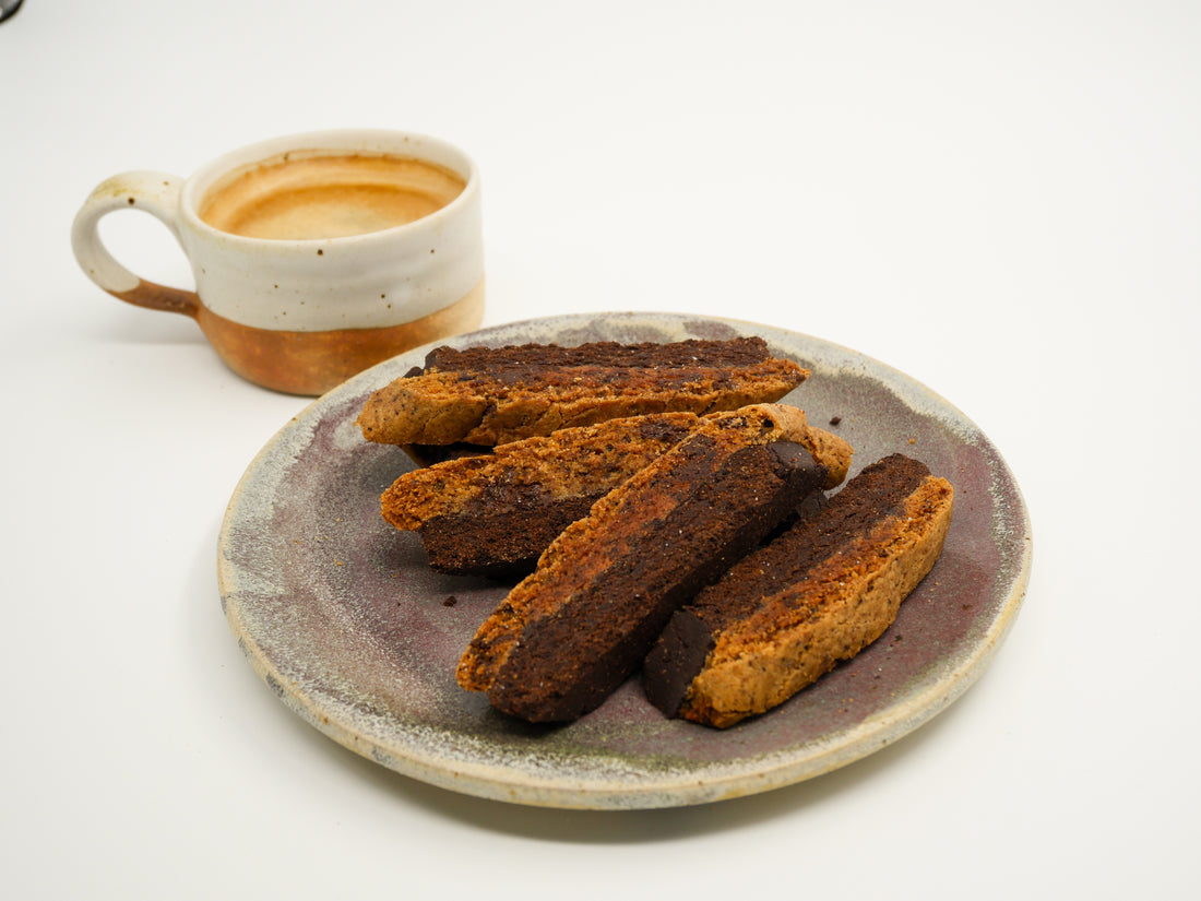 Close-up of Coffee Chocolate Cardamom Biscotti showcasing its crisp texture and rich blend of coffee, chocolate, and cardamom.