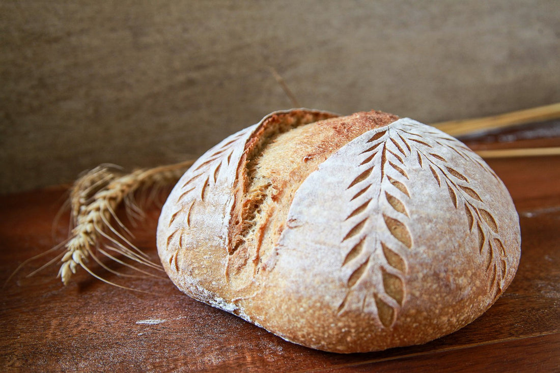 Hearty Khapli Whole Wheat Sourdough loaf with a crisp golden crust and artisanal, rustic finish.